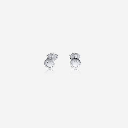 Pair of silver smiley face earrings on a white background