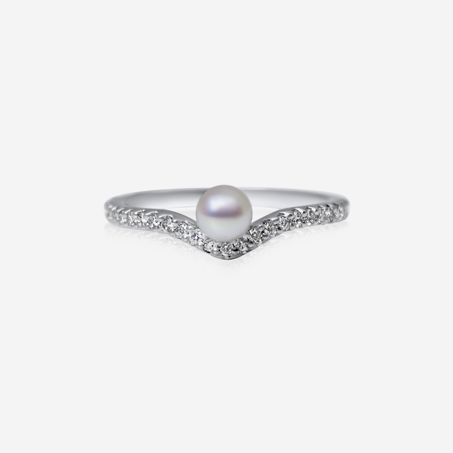An elegant engagement ring featuring a central Akoya pearl surrounded by a recycled round brilliant cut white diamond band.