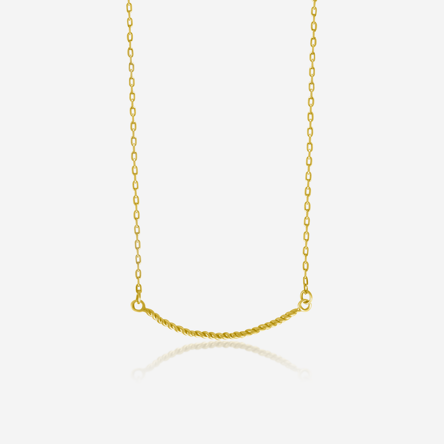 A twisted gold necklace on a plain background, showcasing its shiny gold finish and elegant design.