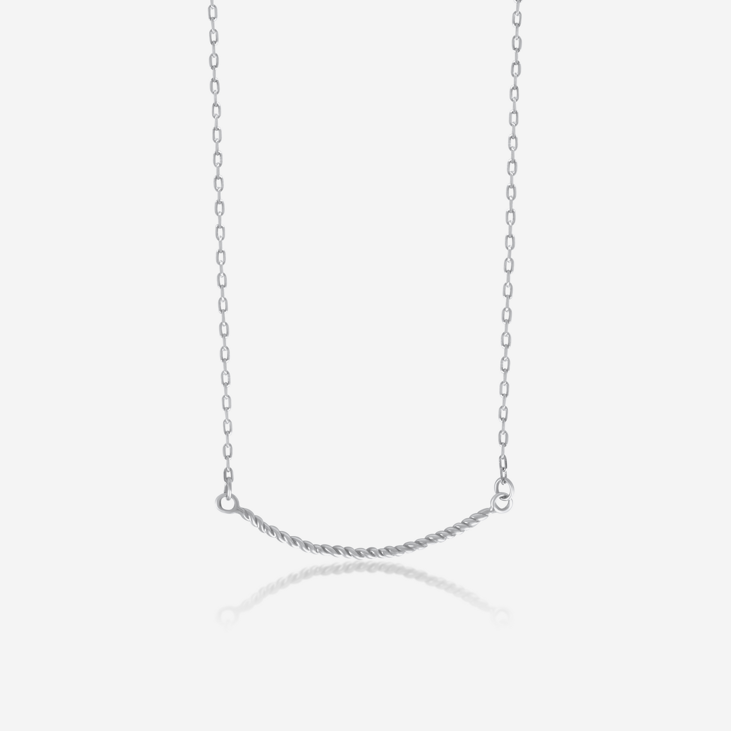 A twisted gold necklace on a plain background, showcasing its shiny gold finish and elegant design.