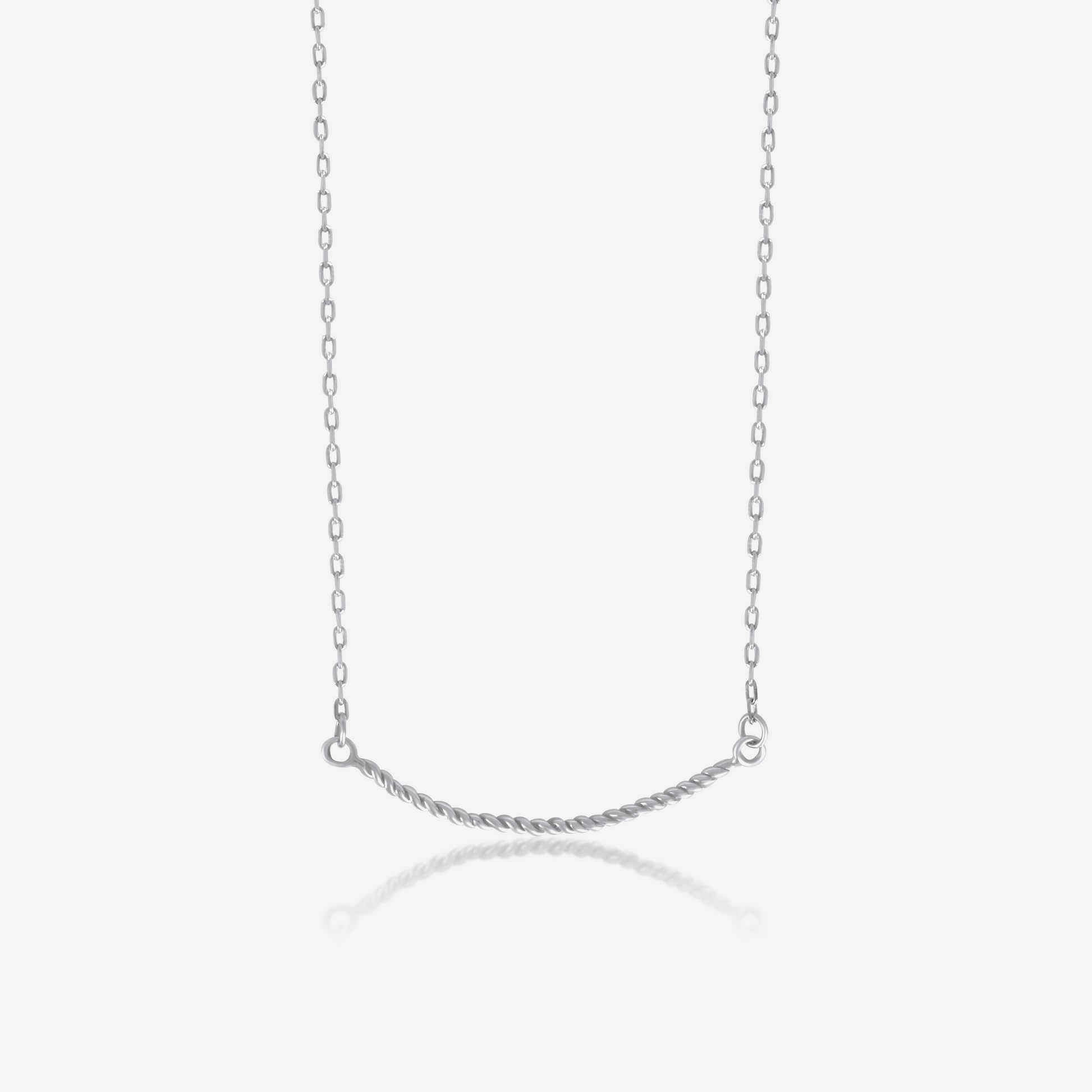 A twisted gold necklace on a plain background, showcasing its shiny gold finish and elegant design.