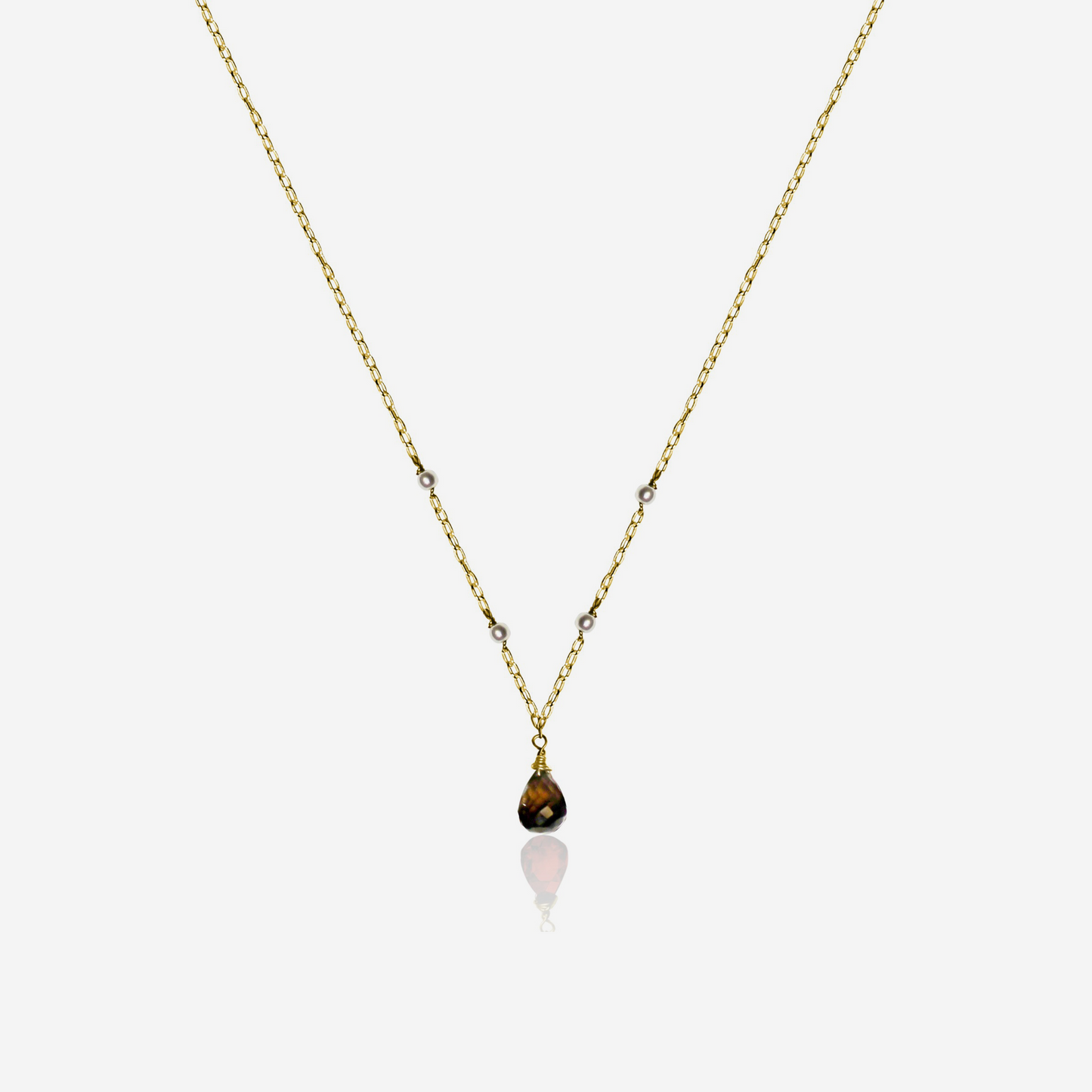 A Smoky Quartz with Tiny Akoya Pearl Necklace on a gold-tone chain with a single smoky quartz pendant and small pearls along the length.