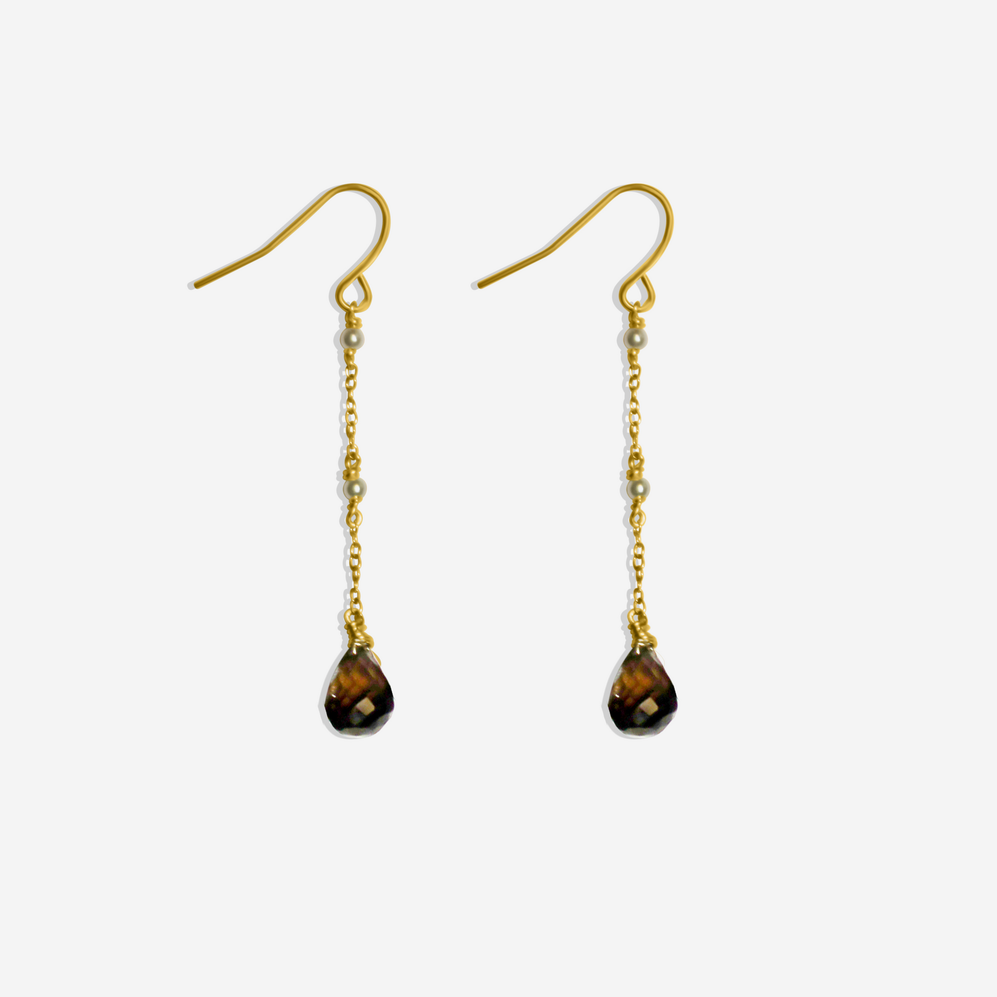 A pair of dangle earrings with smoky quartz at the bottom and tiny akoya pearls along the chain, crafted in 14-karat yellow gold.