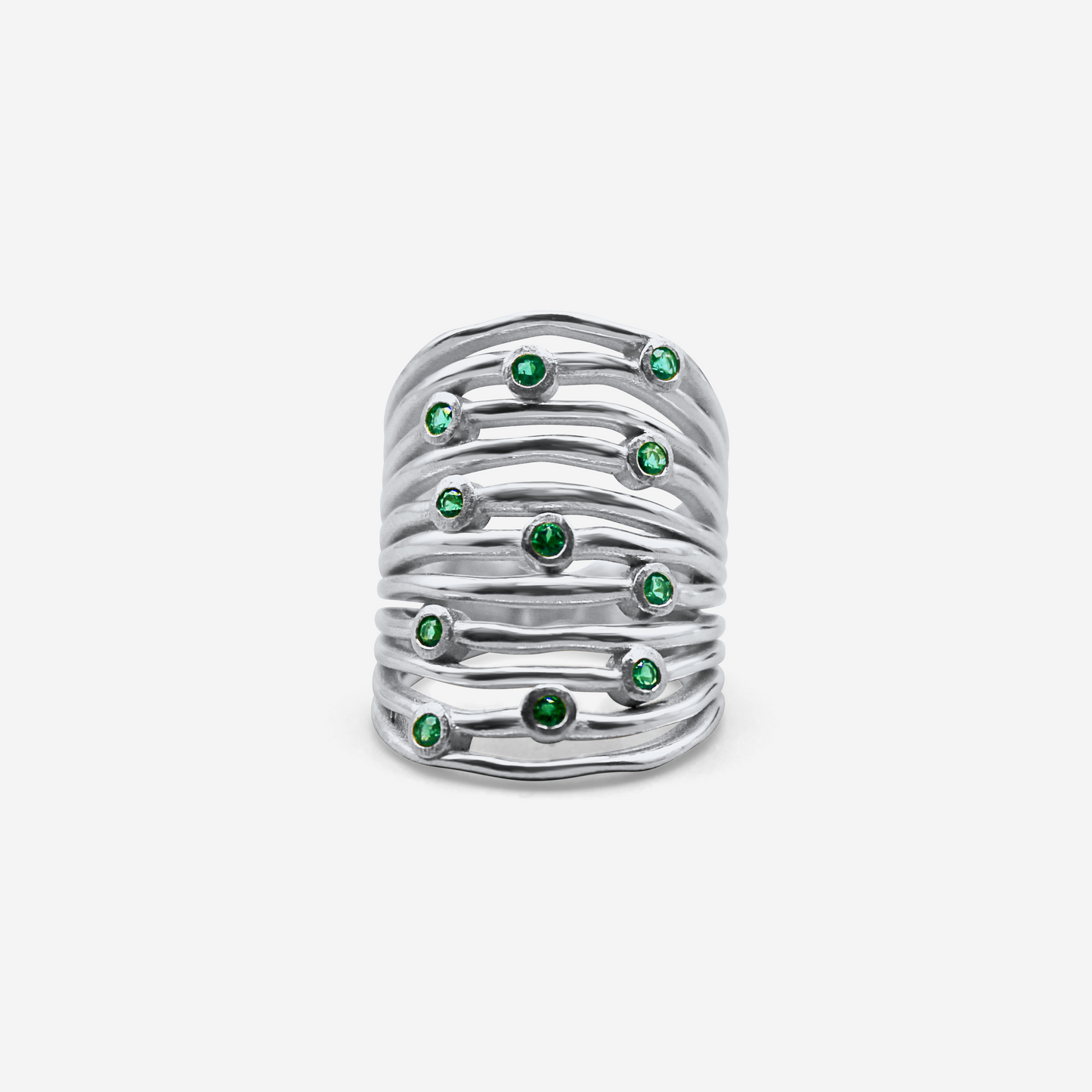 White gold ring with embedded green stones