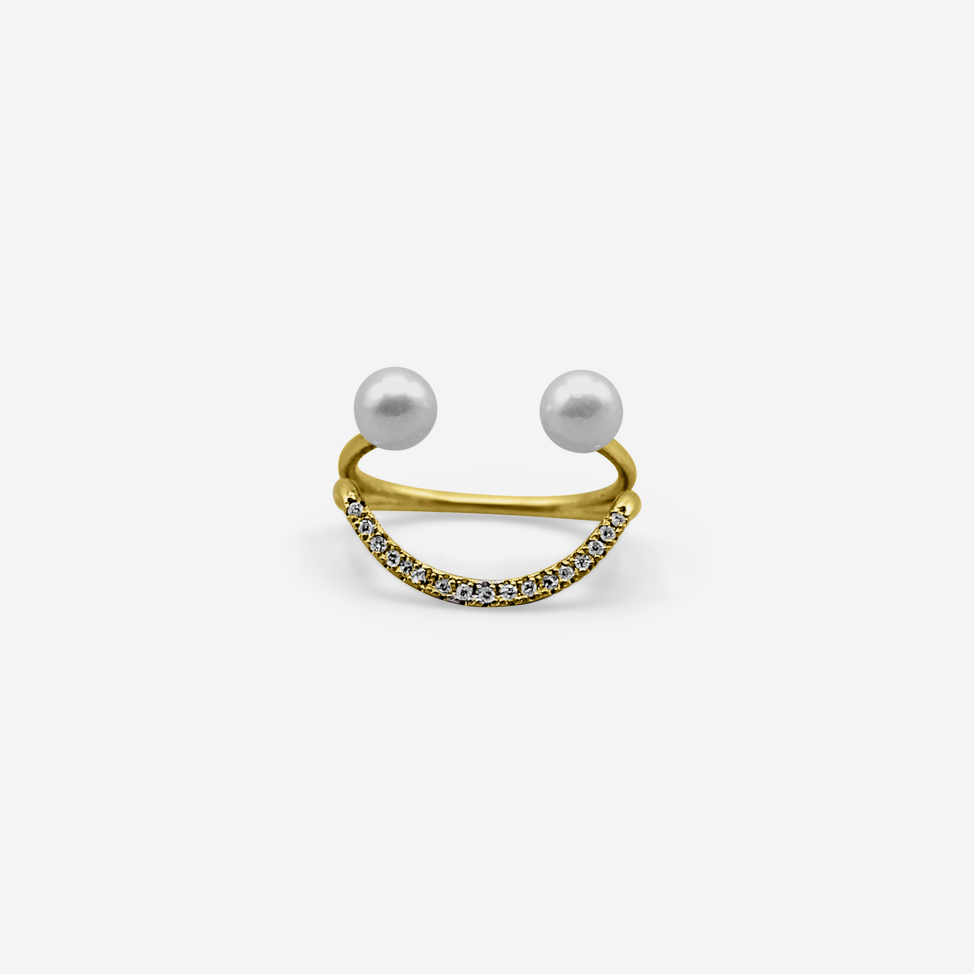 A 14 karat gold ring with a central Akoya pearl and white diamonds arranged in a semi-circular design, symbolizing a smile.