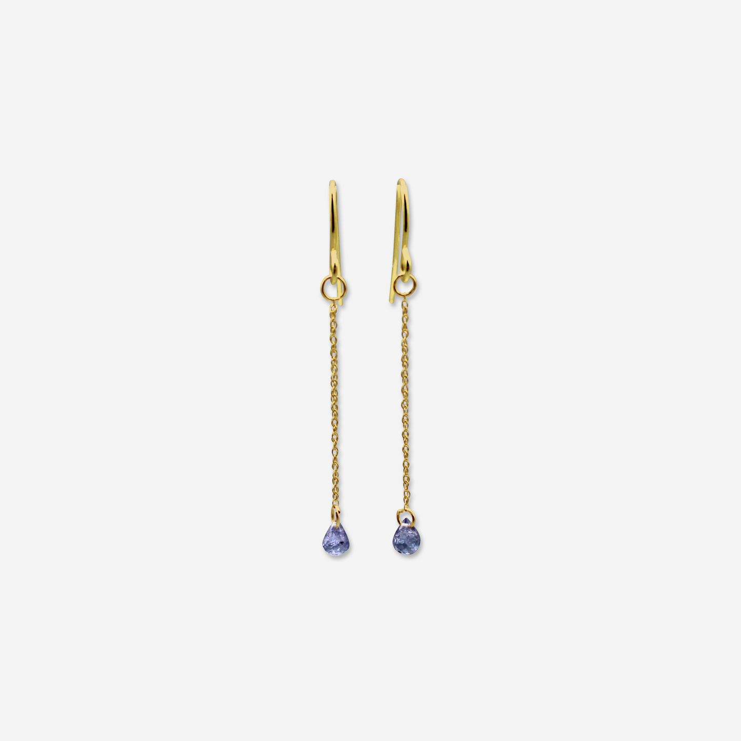 A pair of tanzanite drop earrings with gold settings and chain links, displaying the earrings hanging vertically.
