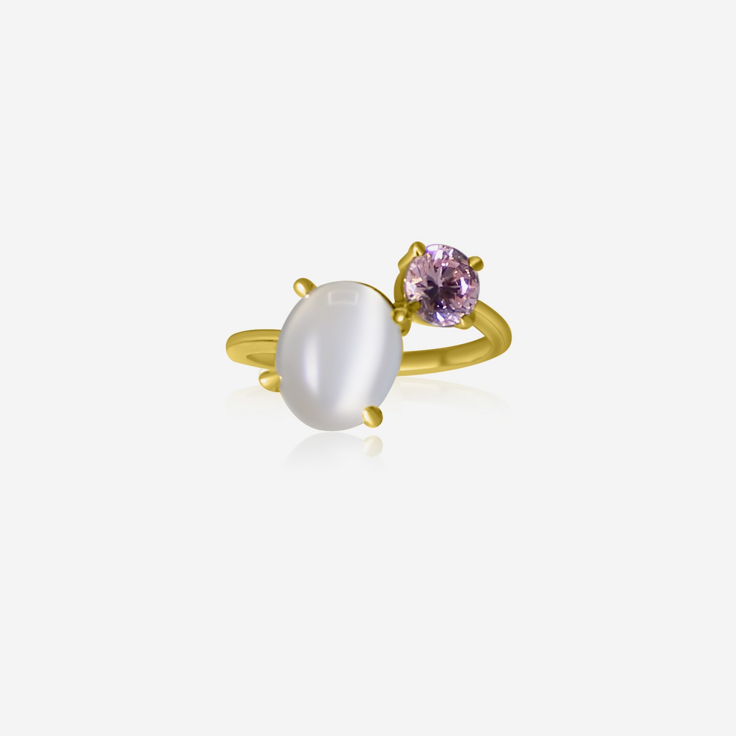 A gold-colored ring featuring an oval-shaped moonstone and a round pink tourmaline stone.