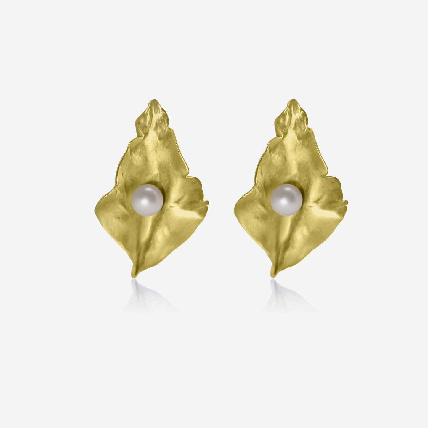 A pair of gold petal-shaped earrings with Akoya pearls at their center, displayed against a white background.