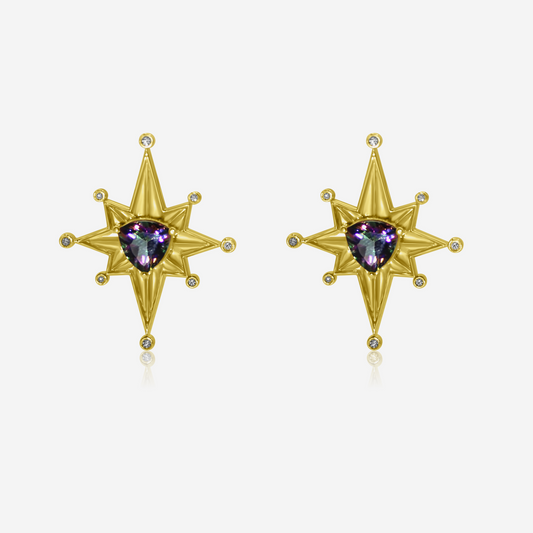 A pair of gold-colored earrings with star-shaped designs and purple Mystic Tourmaline at the center.