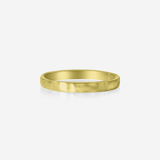 A gold-colored hammered finish wedding ring with a simple and elegant design.