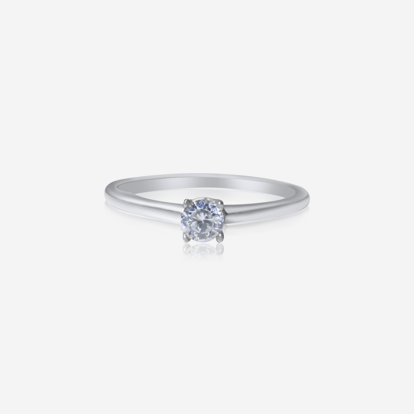 A classic solitaire engagement ring with a single diamond Essence in a white gold band.