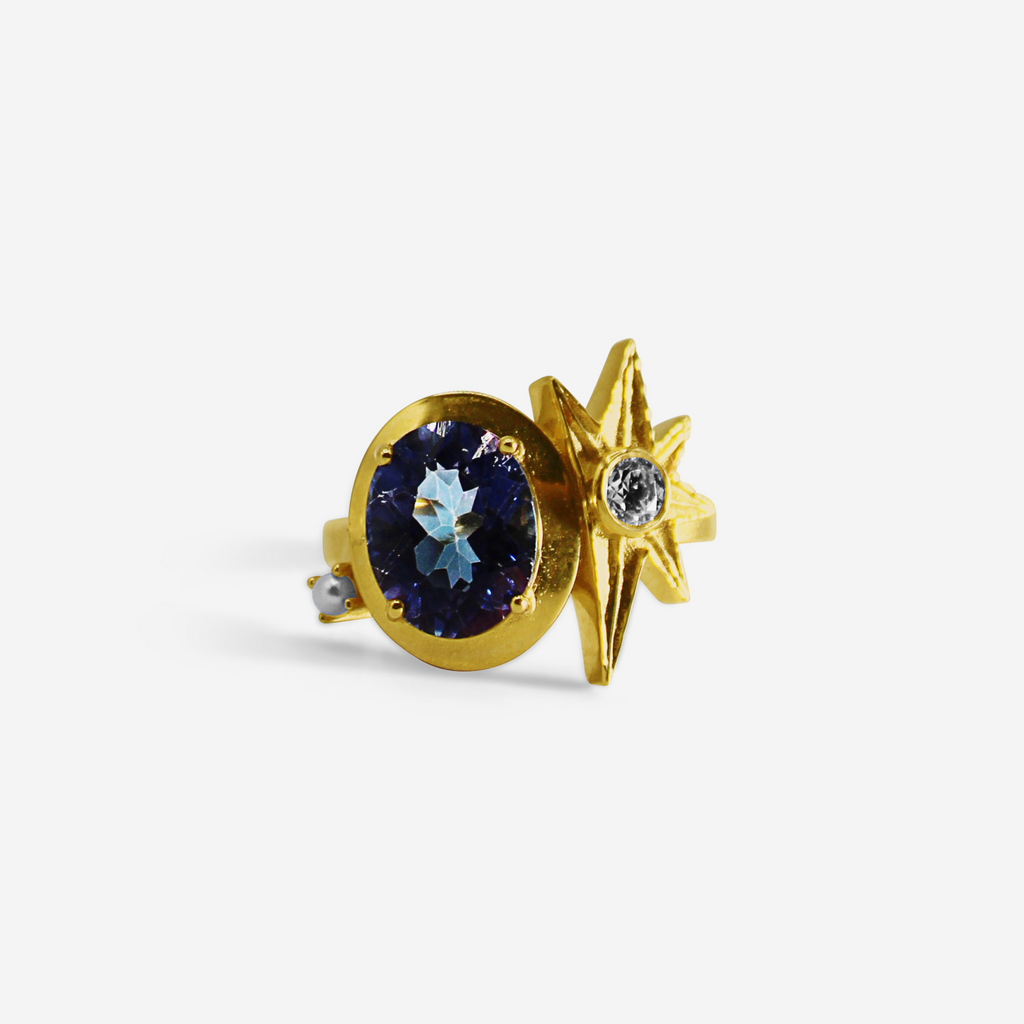 A gold ring featuring a large purple tourmaline stone with smaller gold accents and a smaller clear diamond to the side.