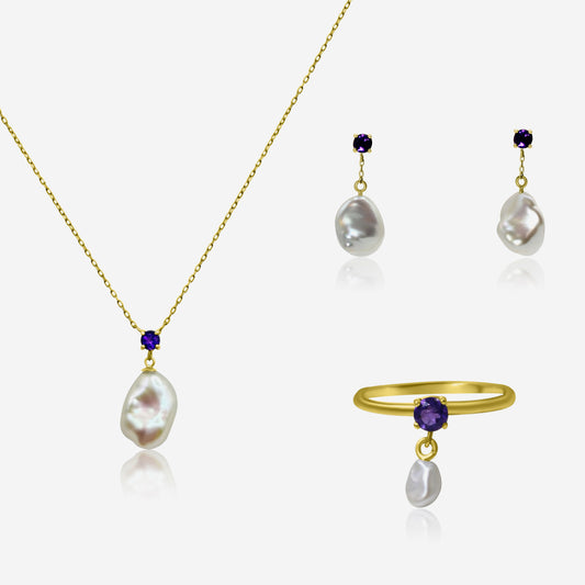 Jewelry set with necklace, earrings, and ring featuring pearls and gemstones on a white background.