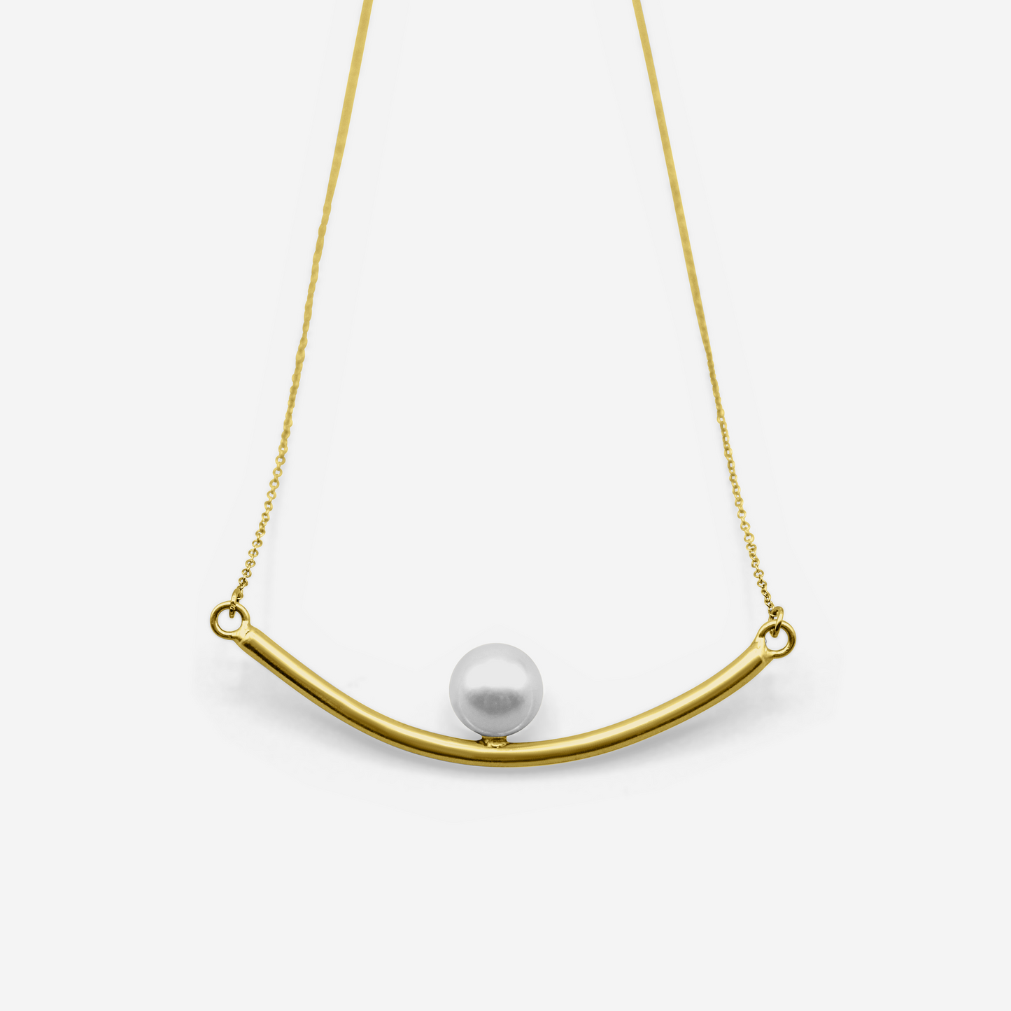 Gold necklace with a curved bar and pearl pendant on a white background