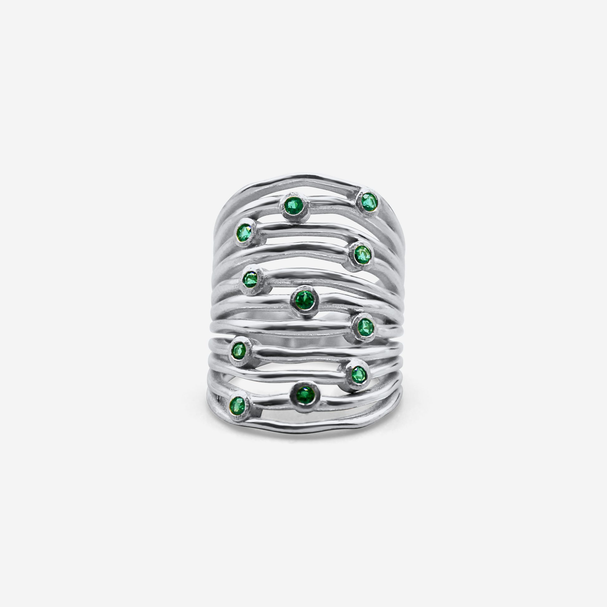 White gold ring with embedded green stones 