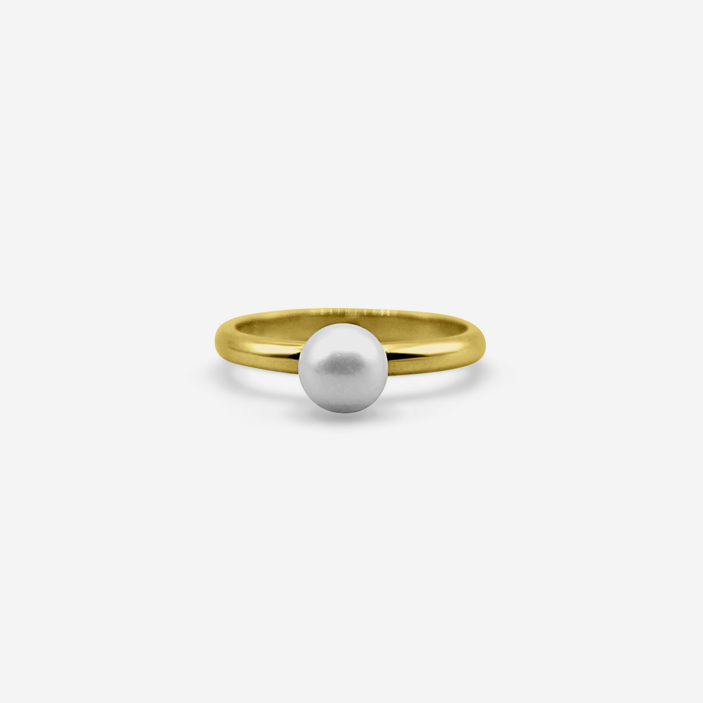 Gold ring with a white pearl on a light gray background