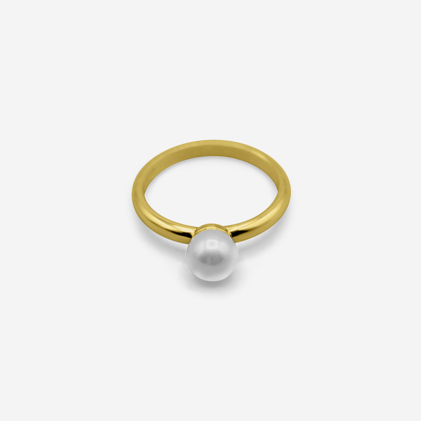 Gold ring with a pearl on a white background